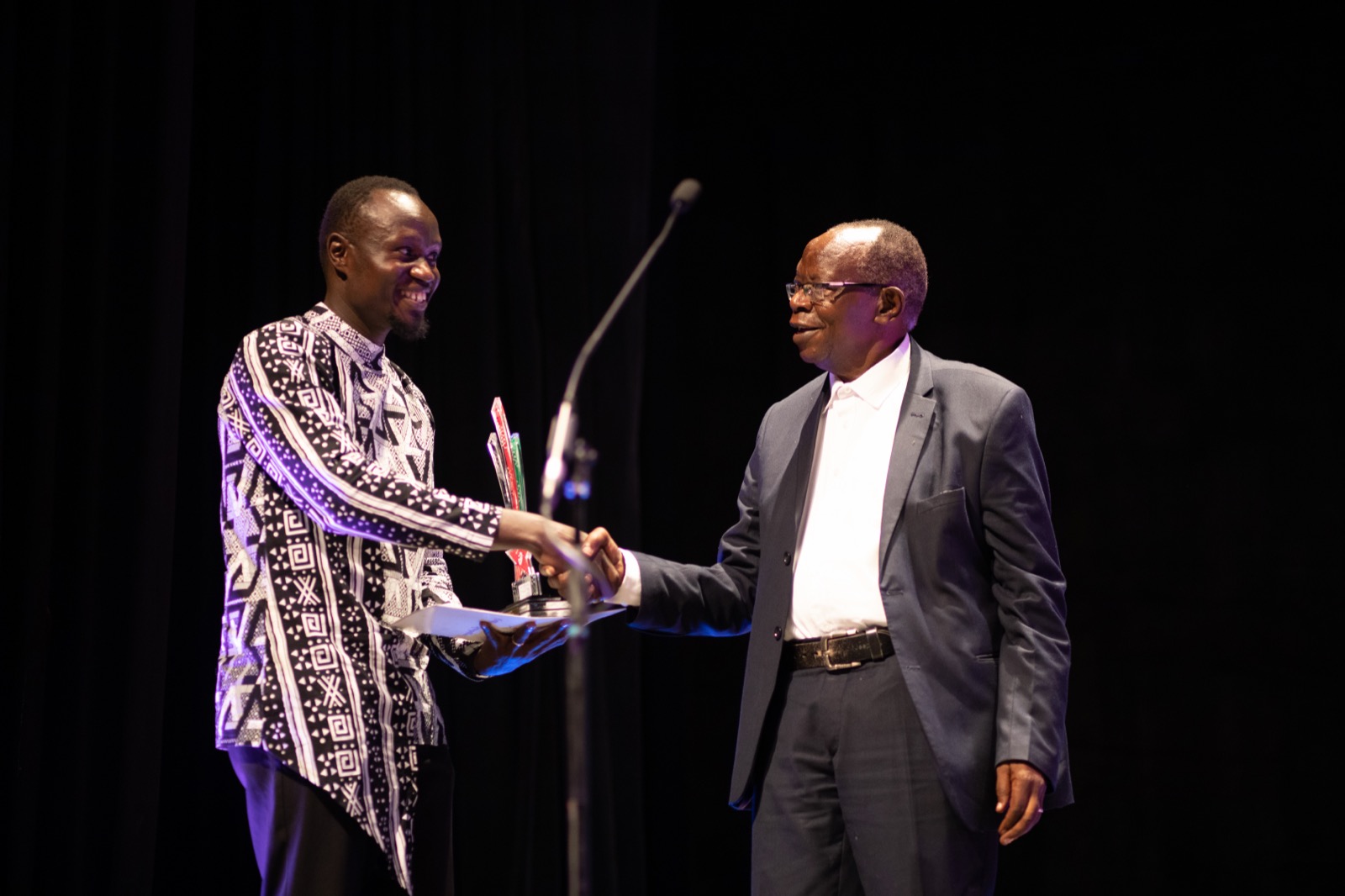An artist receiving a KITFest award on stage